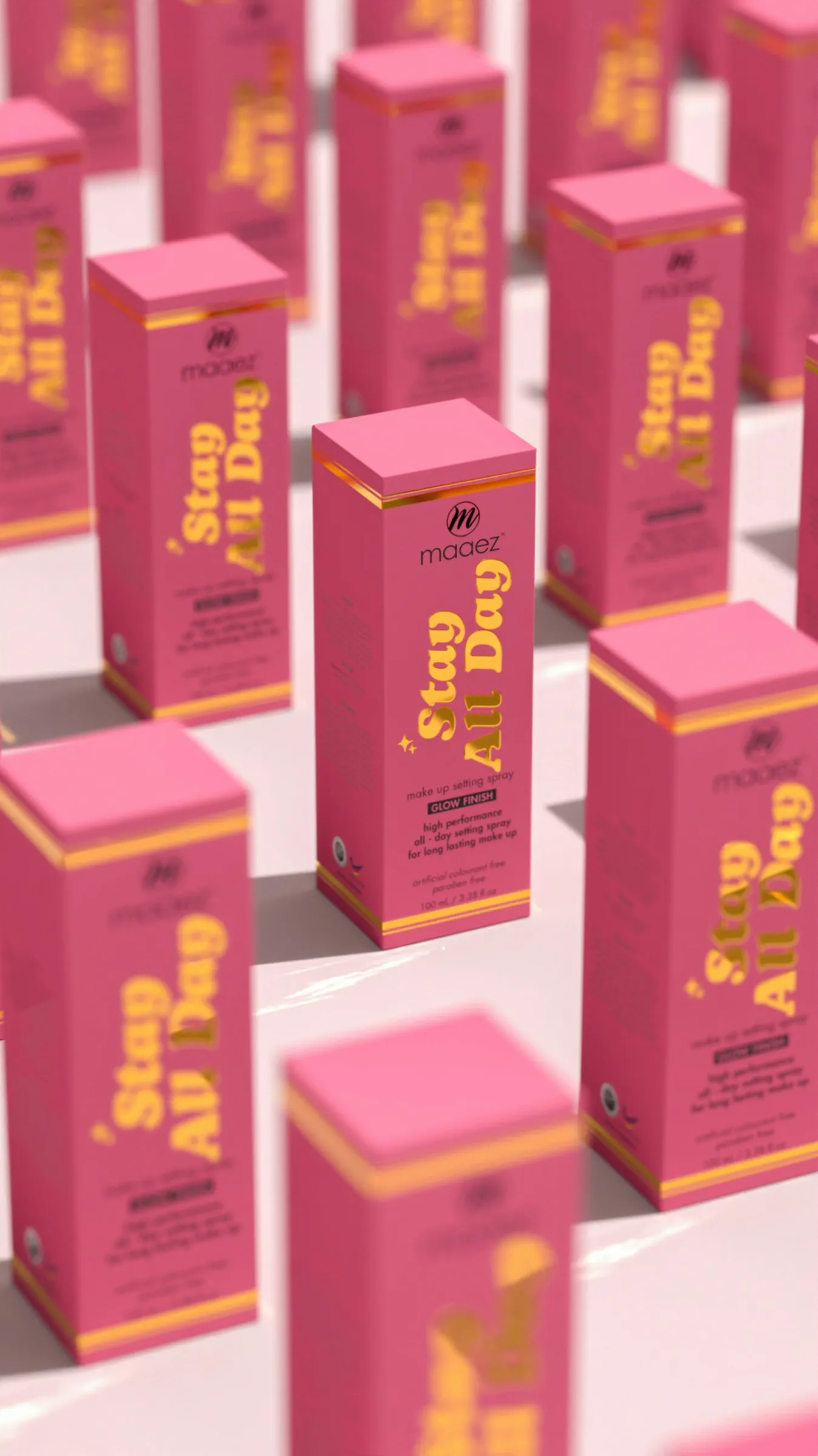 Rows of pink cosmetic cartons with gold foil script lettering