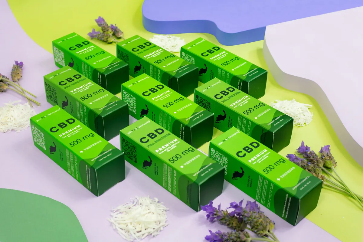 Grid of green printed cartons on a lilac and green set