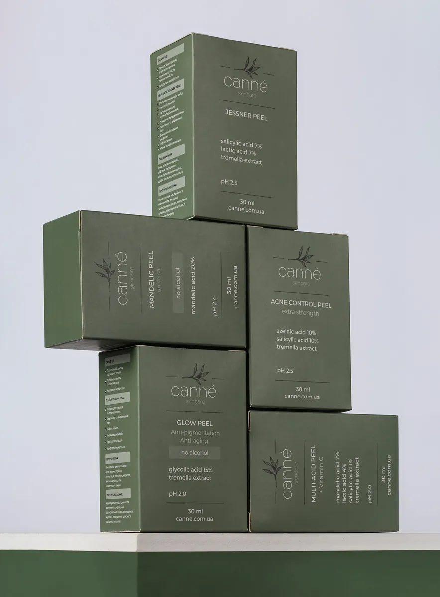 Stack of green skincare cartons with white print
