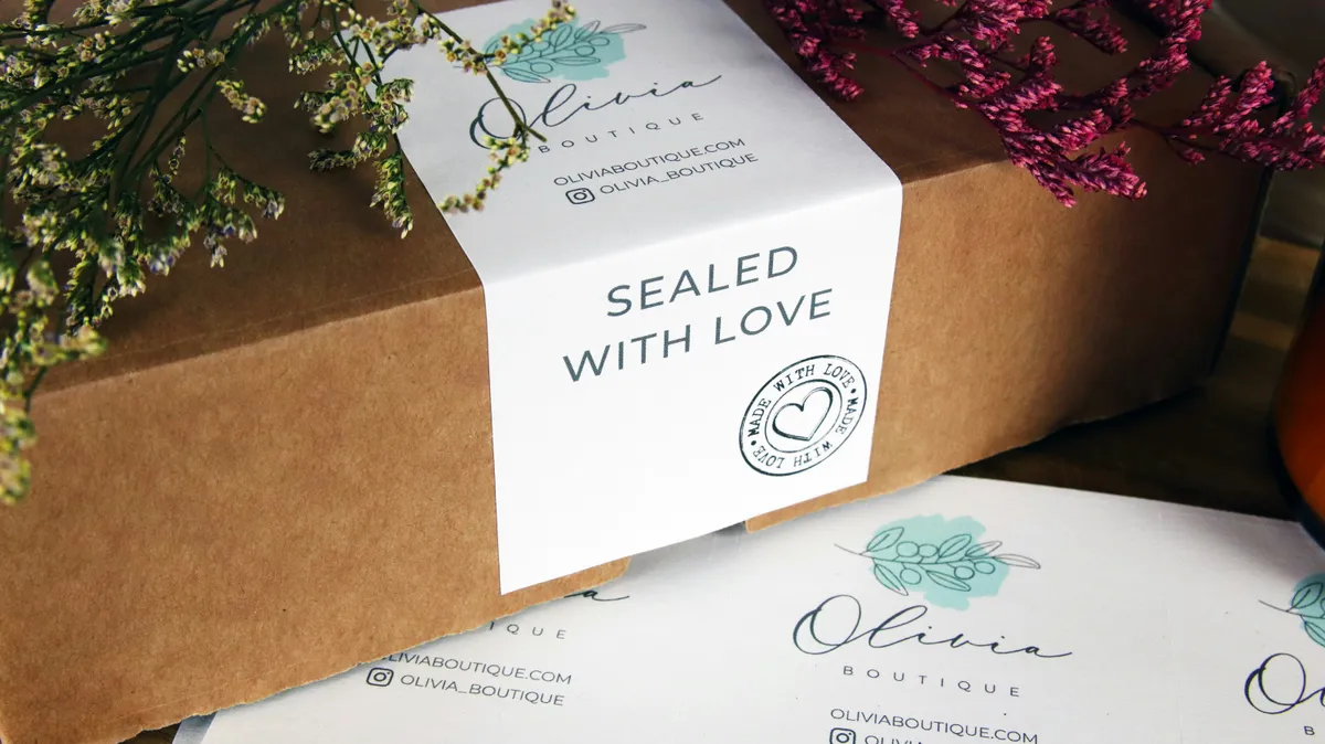Kraft mailer box wrapped in a printed paper sleeve with a handwritten-style message
