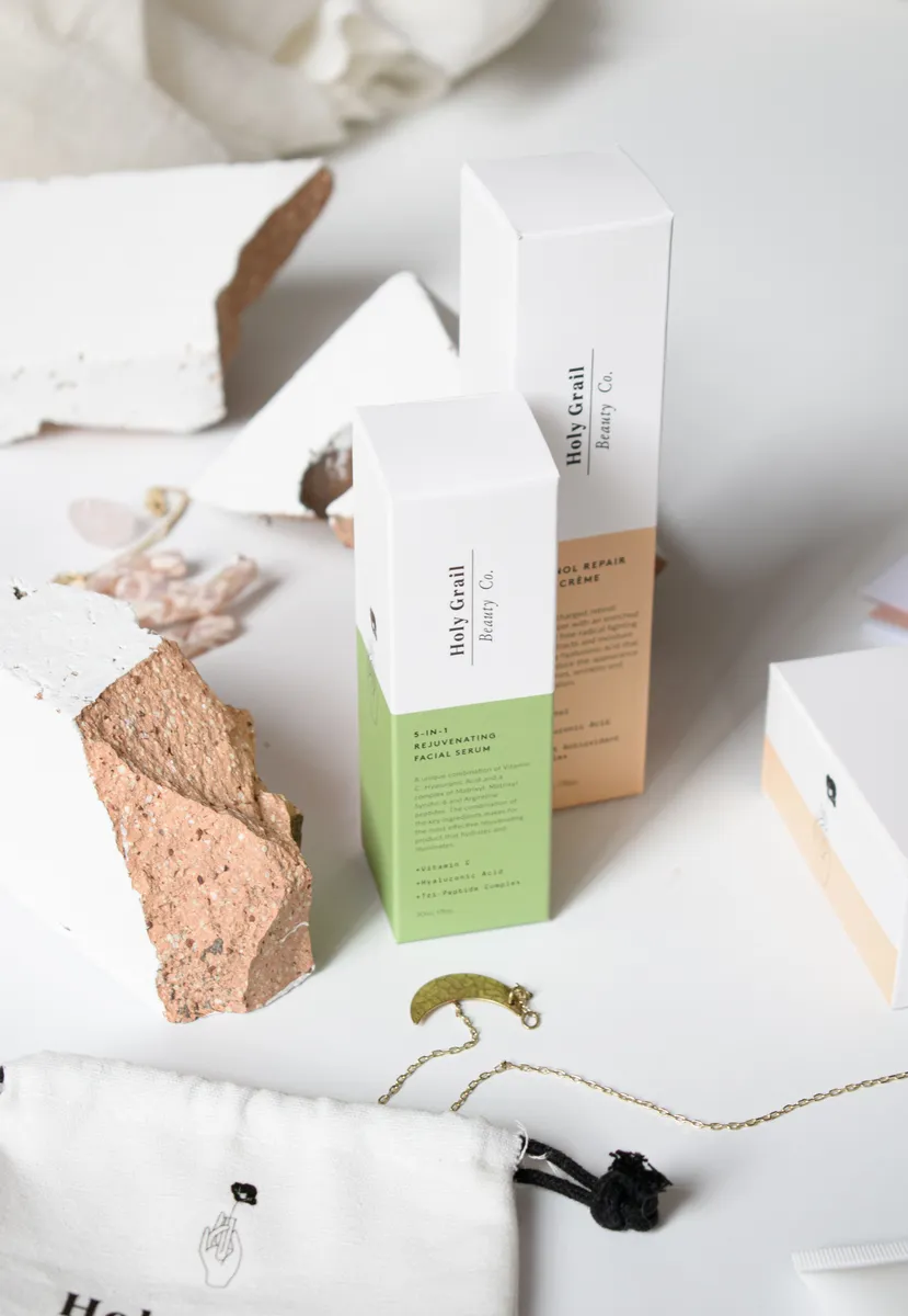 Minimal white and pastel skincare cartons on white