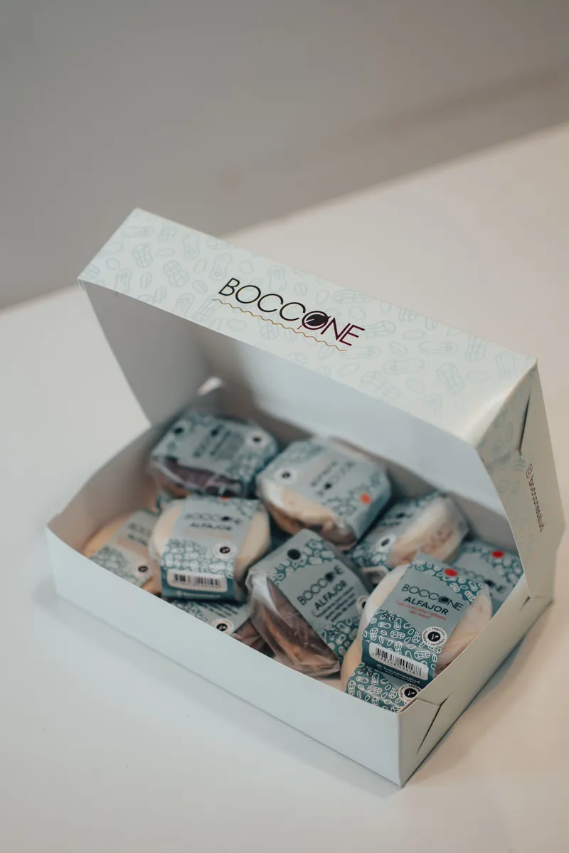 Open white printed folding carton filled with individually wrapped sweets
