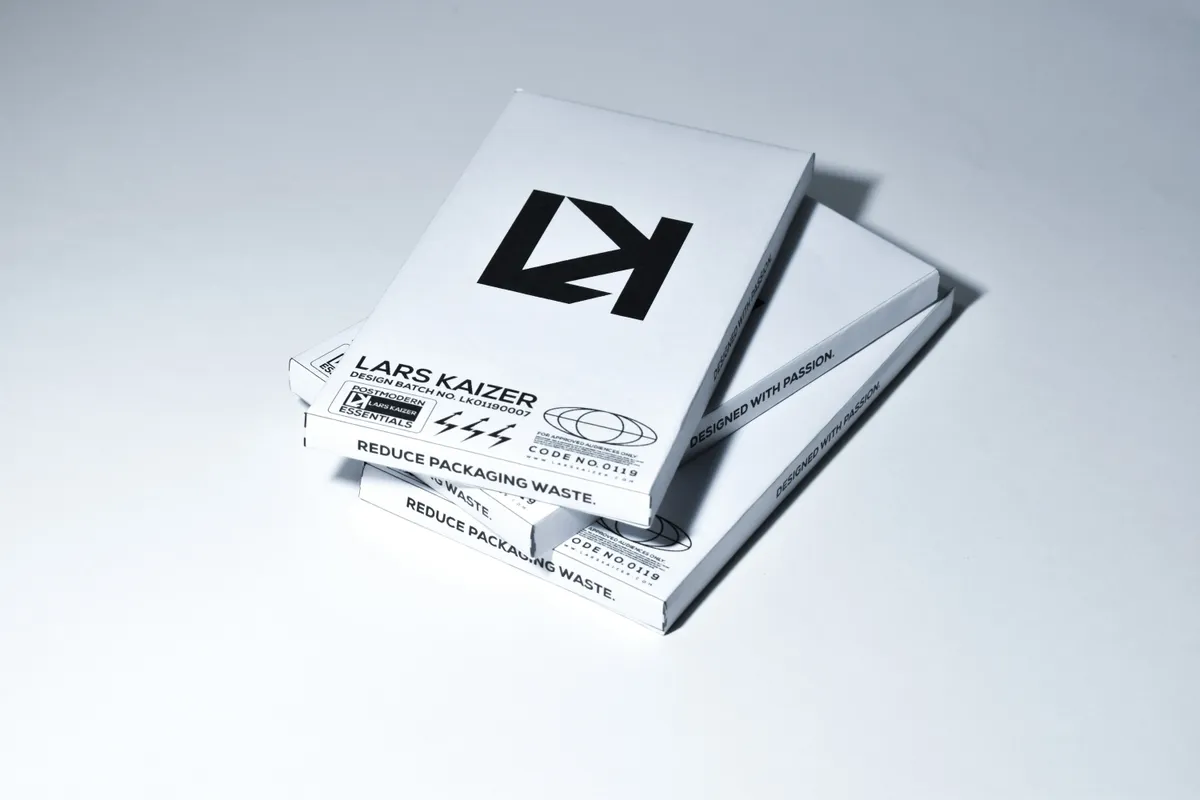 Stack of white printed tuck end boxes with black graphics