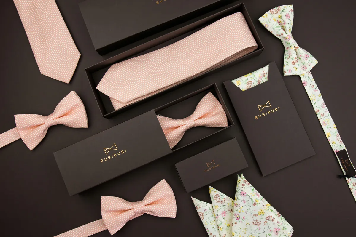 Black gift boxes and sleeves for bow ties and ties with gold foil logos