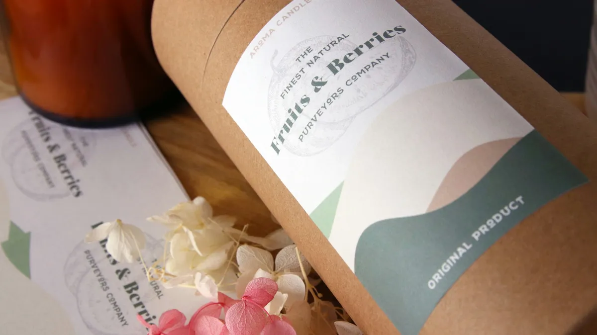 Kraft paper tube for an aroma candle with a printed label in sage and blush tones